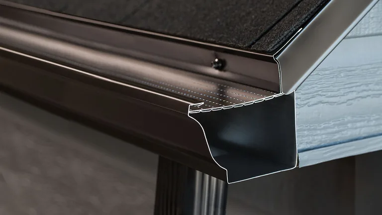 Close-up of the Alu-Rex DoublePro microfiltration continuous hanger on a shingle roof